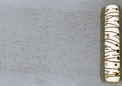 marks in clay made by this roller