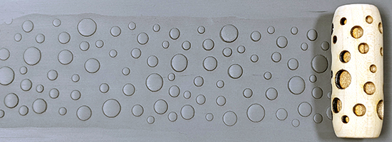 marks in clay made by this roller