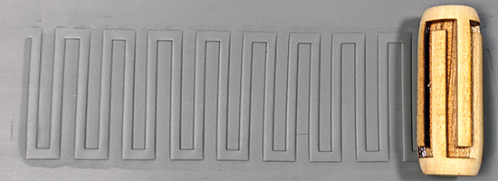 marks in clay made by this roller